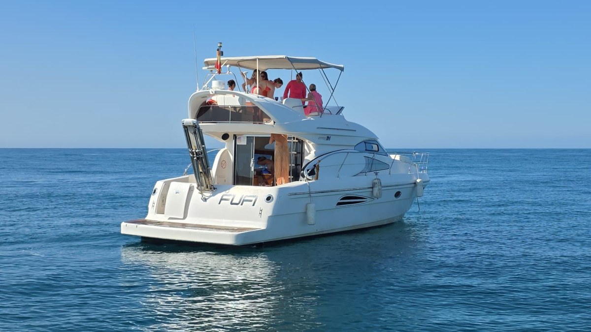 Astondoa 40 "Fufi" anchored with guests aboard off the Marbella coast