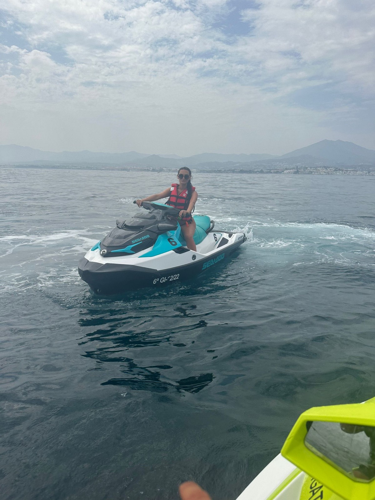 Rider on a Sea-Doo GTX jet ski with La Concha mountain behind, Marbella
