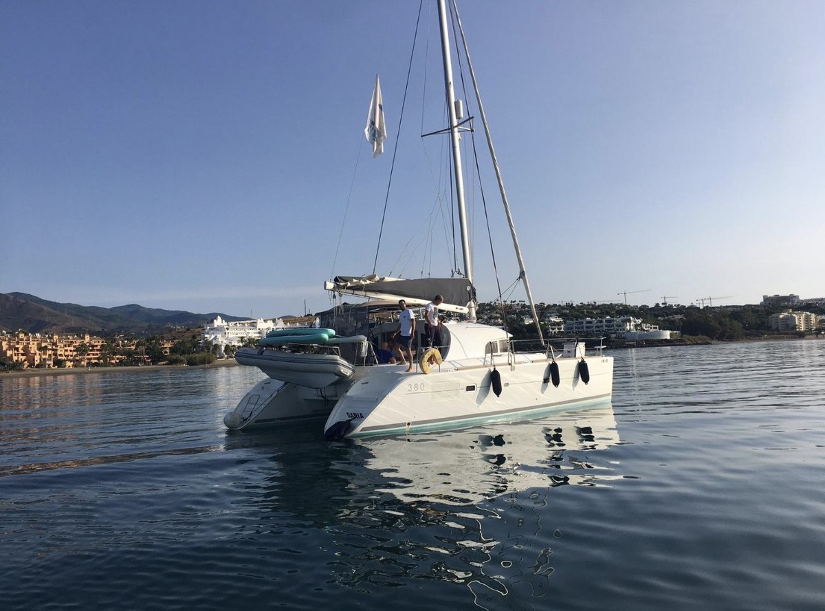 Lagoon 380 catamaran anchored off Marbella coast
