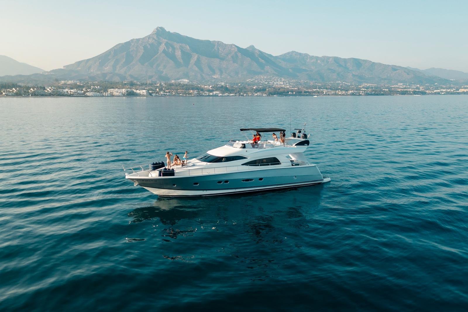Nuvari 64 "Avaco" motor yacht anchored off Marbella with La Concha mountain behind