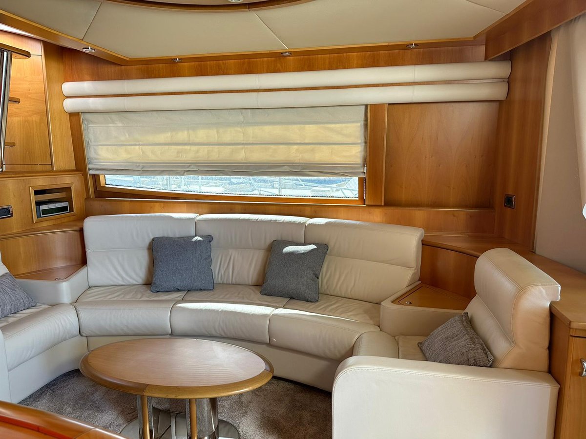 Nuvari 64 interior saloon with wood finish and wraparound seating