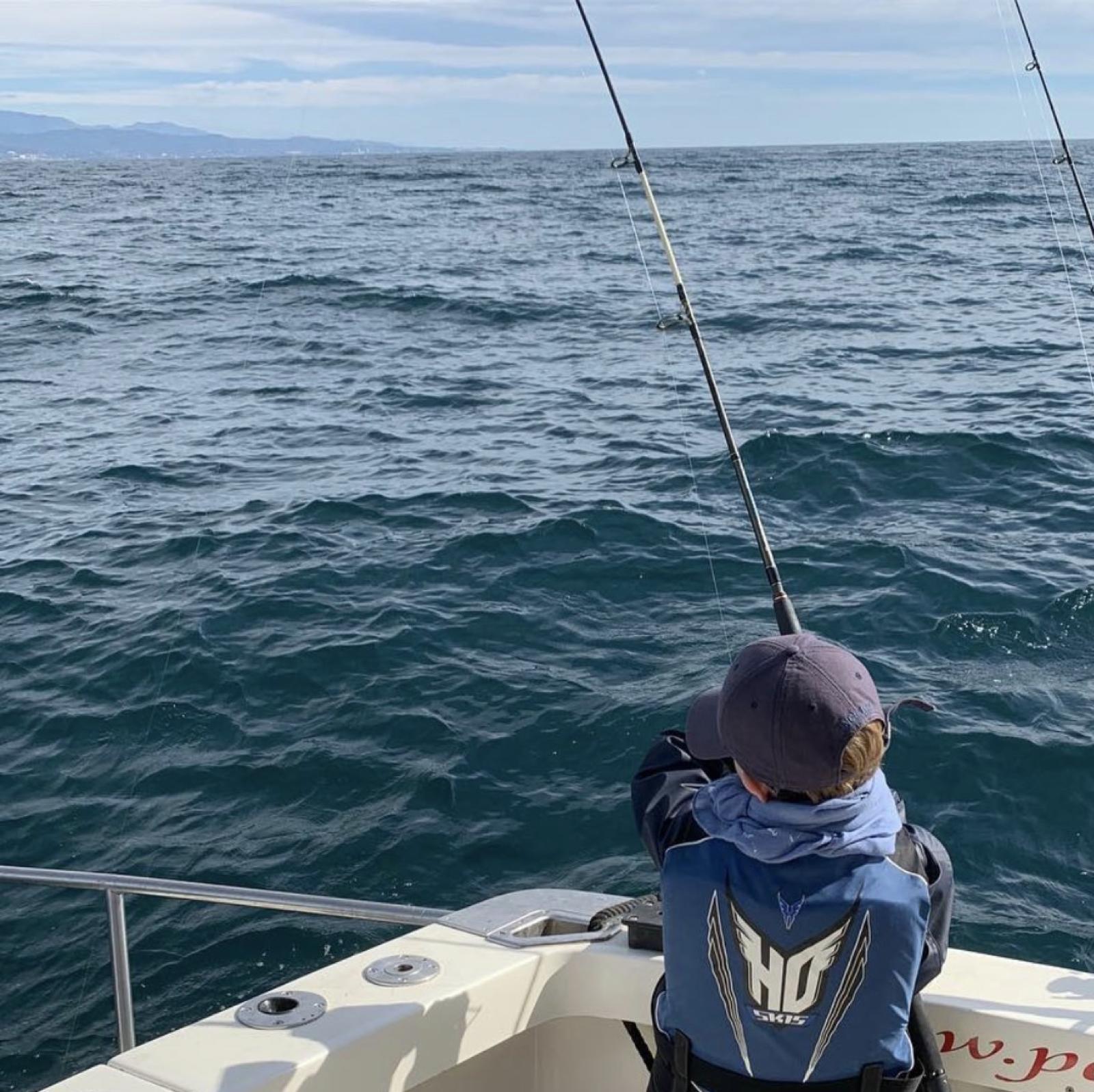Young angler trolling off Marbella on our sport-fishing charter